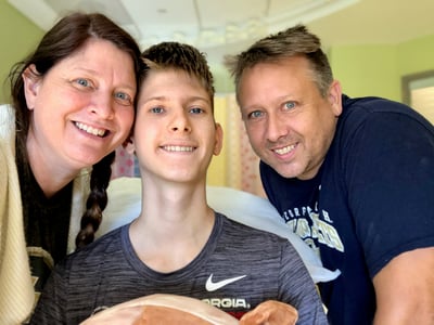 Boy with family at hospital