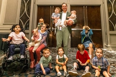 Dr. Christian Schaaf with children who have SYS.