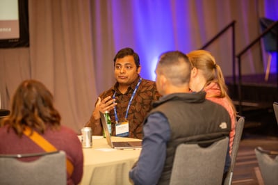 Dr. Singh talking to families during conference.